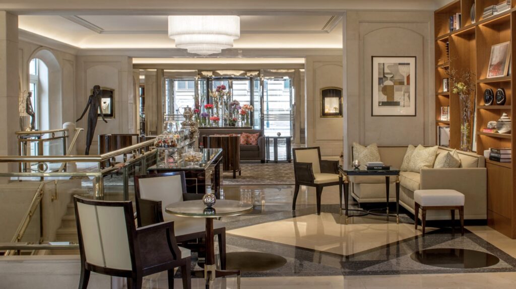 Afternoon tea at the Four Seasons Prague with pastries, cakes, and hot chocolate served in the elegant hotel lobby during winter.