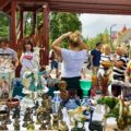 Hunting for antiques in Hungary, at the Hévíz Saturday flea market — tables filled with vintage porcelain, glassware, and collectibles.
