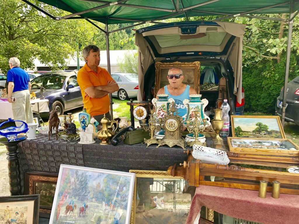 Vintage Hungarian home décor and porcelain planter boxes displayed at Hévíz weekend antiques market, one of the best places to buy antiques in Hungary.