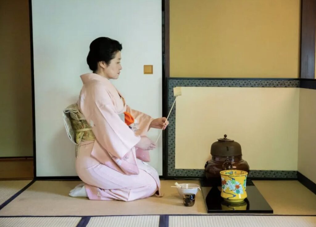 Omotesenke-style Japanese tea ceremony at Hotel Chinzanso Tokyo, with a tea mistress performing traditional rituals inside a historic tatami tea house surrounded by gardens