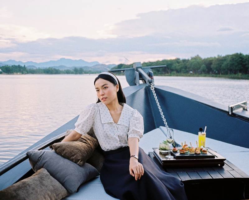 Le Ha Truc appeared on Azerai La Residence, Hue’s elegant new 17-meter riverboat as it plied the Perfume River at dusk