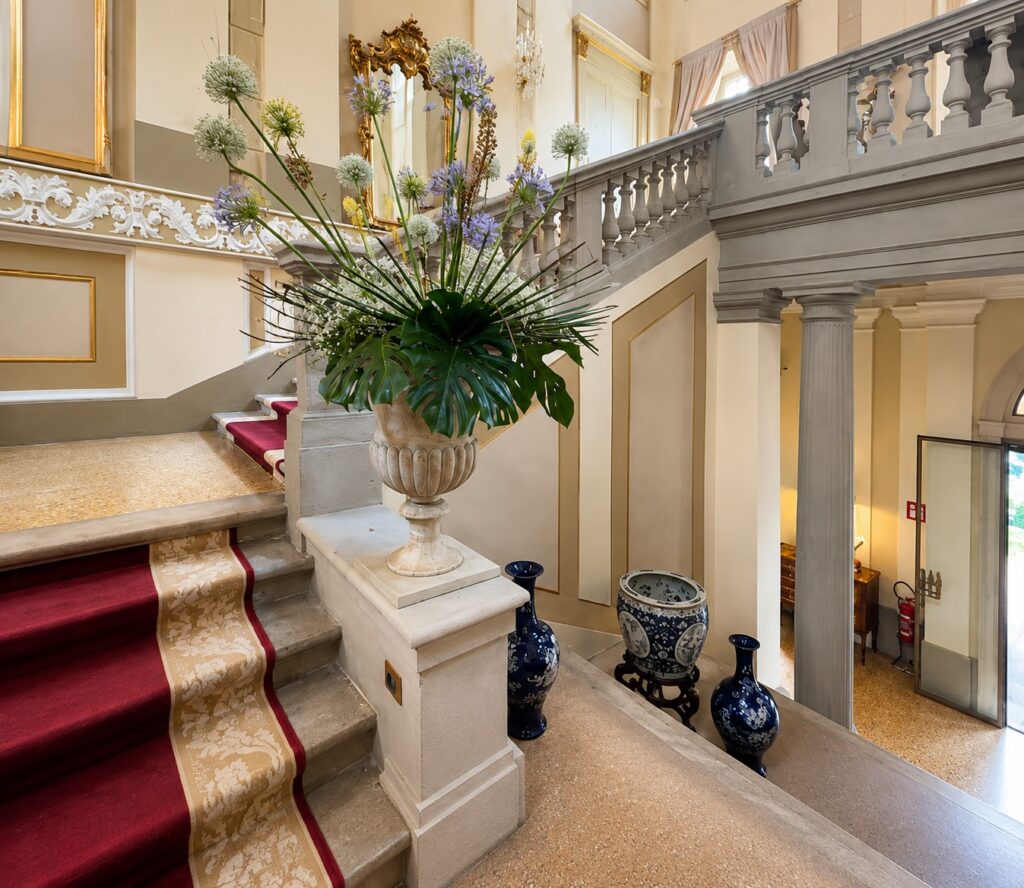 Historic entrance hall and staircase at Passalacqua hotel on Lake Como