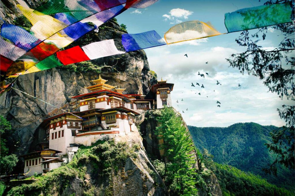 Tiger’s Nest Monastery in Bhutan — a sacred Himalayan temple above Paro Valley, framed by prayer flags and panoramic mountain views, a must-visit on a luxury Bhutan itinerary.