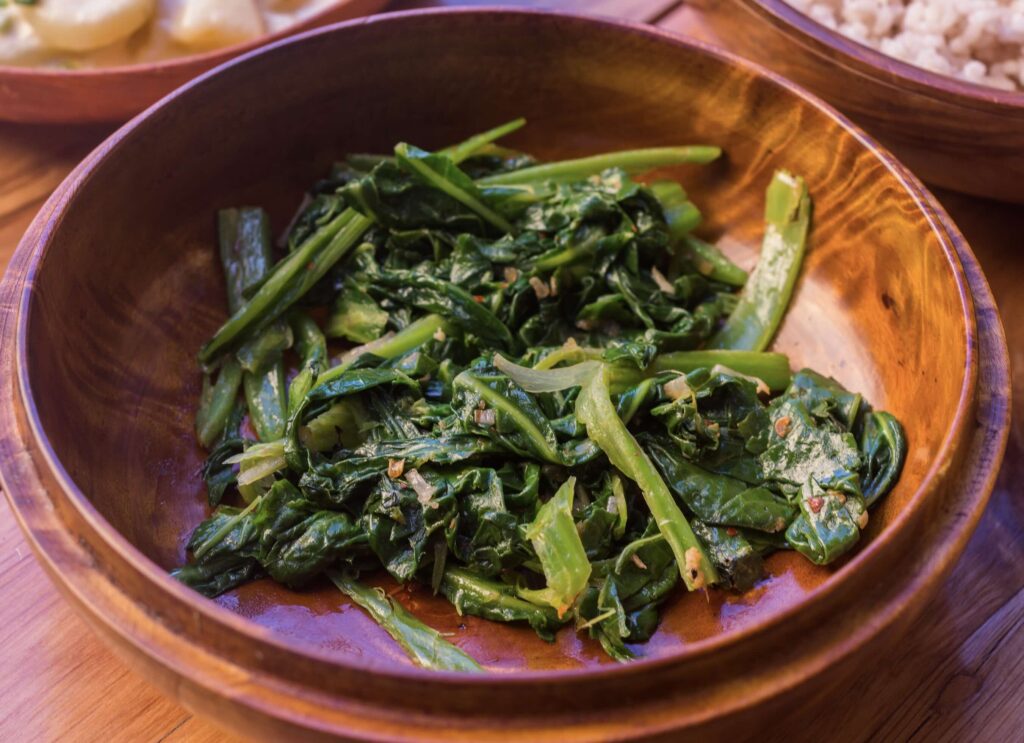 Saag Fry, which is leafy greens stir-fried with garlic and butter, is another favorite food in Bhutan.