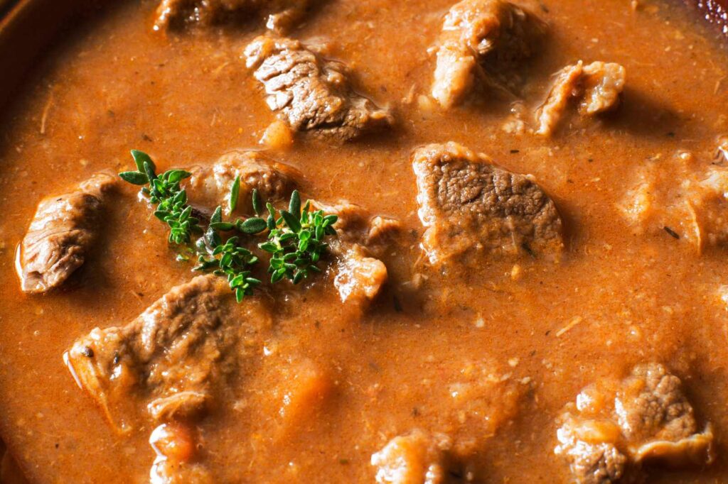 Tender cuts of meat, along with paprika and spices, are used for making authentic goulash in Budapest.