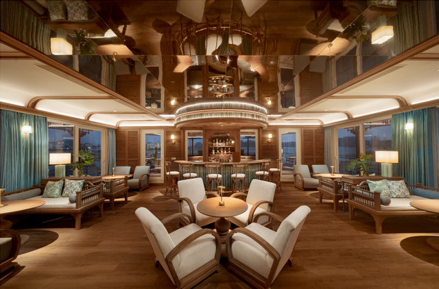 The Bhaya Soul onboard lounge with floor-to-ceiling bay windows allows guests to fully enjoy the scenic views of Halong Bay in Vietnam.