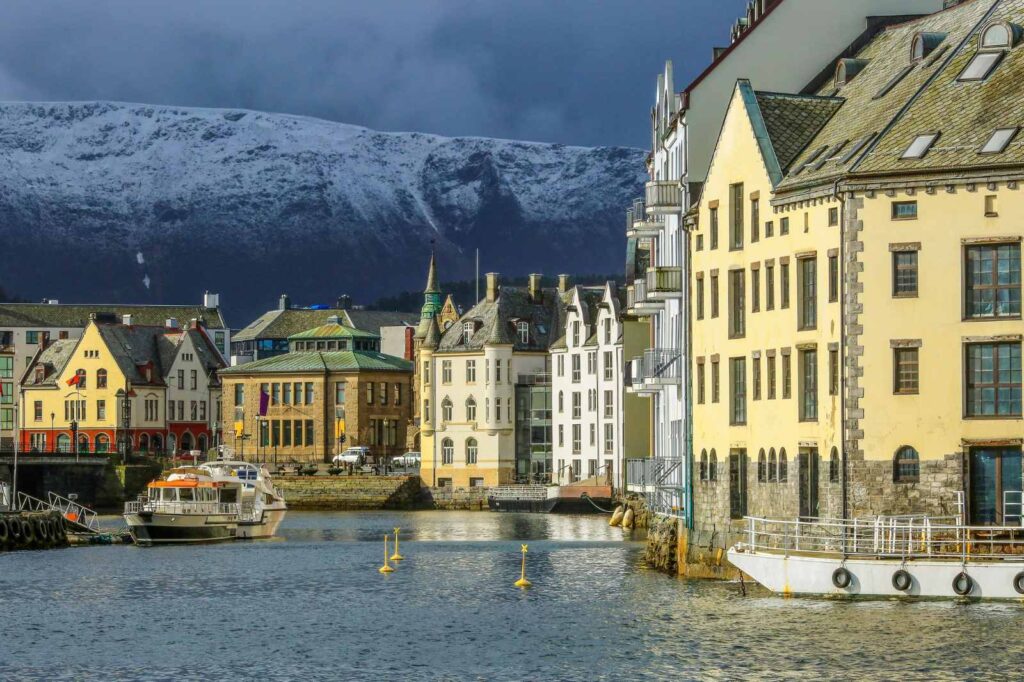 View of the art nouveau buildings in downtown Alesund, along the Brosundet Canal, in Norway.