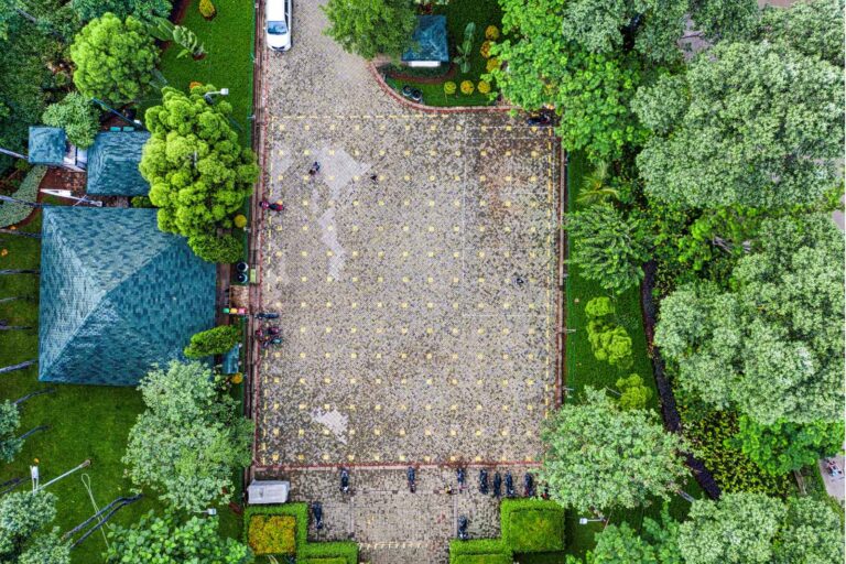 Beautiful hotel garden in Asia featuring tropical plants, landscaped pathways, and serene outdoor spaces commonly found in luxury Asian resorts.