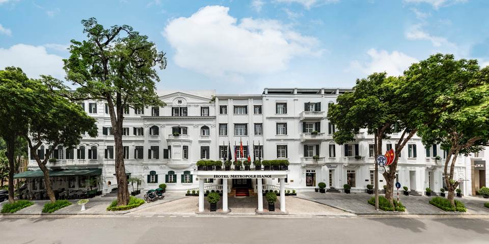 Exterior view of Sofitel Legend Metropole Hanoi featuring French colonial architecture and landscaped courtyard