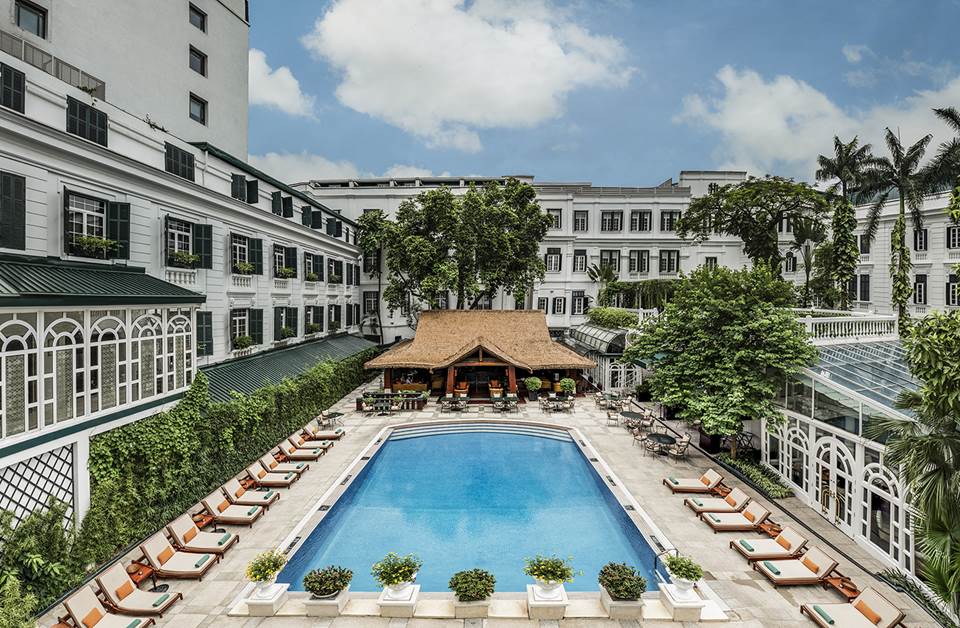 Swimming pool courtyard at Sofitel Legend Metropole Hanoi surrounded by elegant French colonial architecture