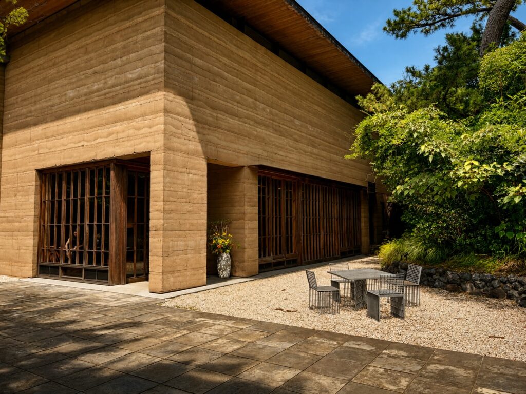 Contemporary guest building at Numazu Club, a Michelin One-Key luxury ryokan in Shizuoka, Japan, blending modern Japanese architecture with traditional craftsmanship. Designed by architect Akira Watanabe. Photographed by Travelife Magazine.