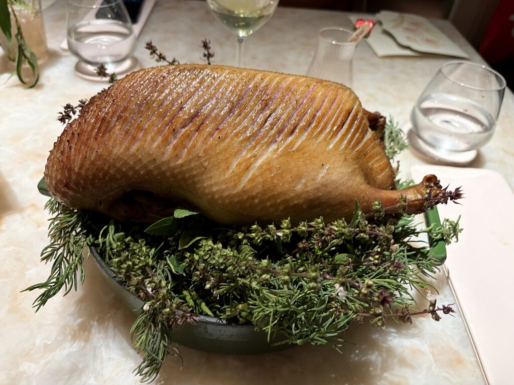 Roasted duck served with fresh herbs at Baan Phraya, Mandarin Oriental, Bangkok.