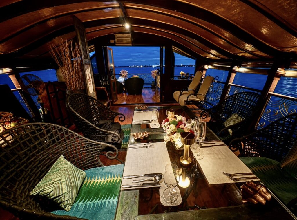 Dinner table set aboard Loy Dream during an Anantara Chao Phraya River cruise