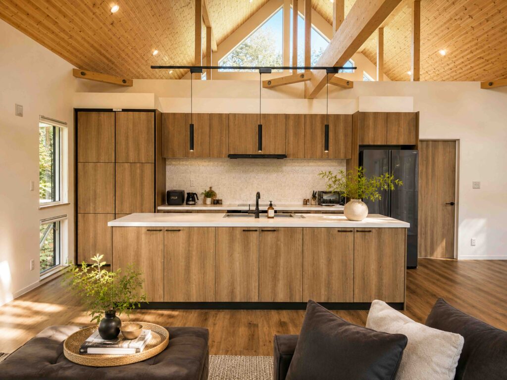 Modern open-plan kitchen with wood cabinetry and island at Soga Forest Chalet, an Elite Havens luxury villa in Niseko, Hokkaido, Japan.
