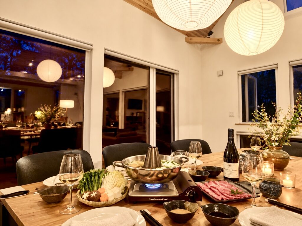 Japanese shabu-shabu dinner set on the dining table at Soga Forest Chalet, a private luxury chalet in Niseko, Hokkaido, Japan.