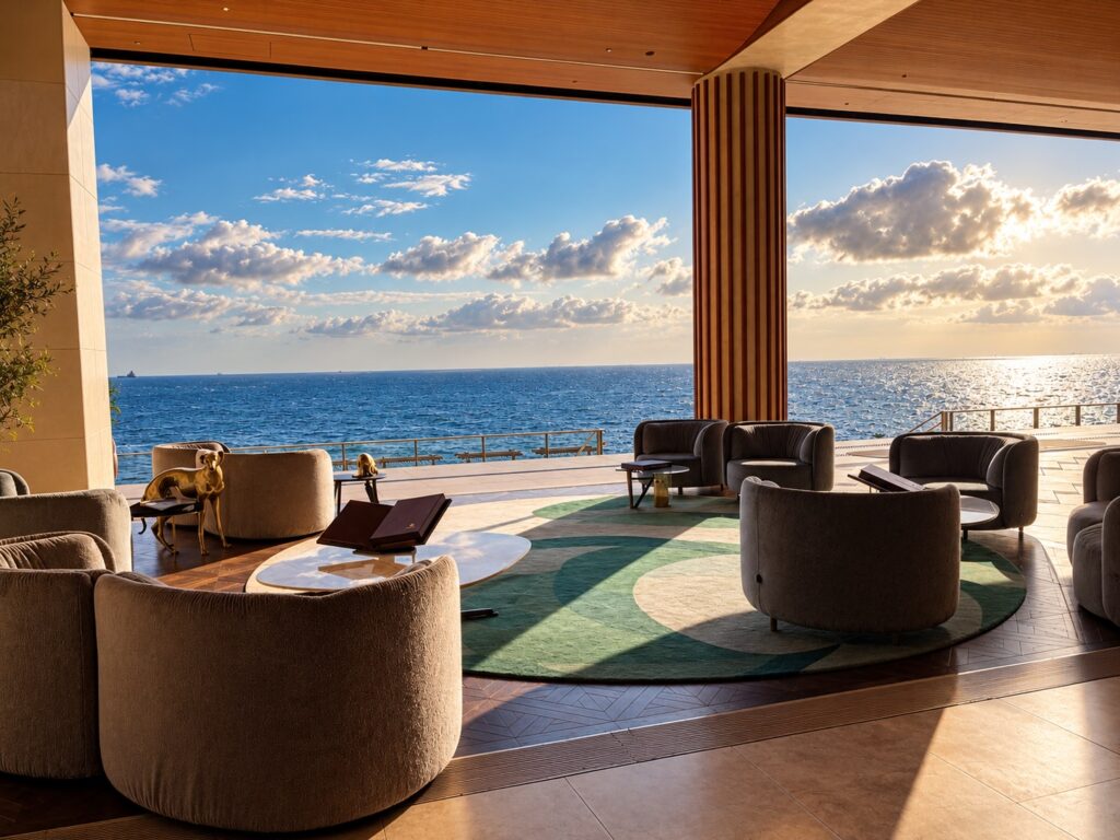 Oceanfront lounge with contemporary seating and panoramic sea views at THE PASONA natureverse retreat on Awaji Island, Hyogo, Japan.